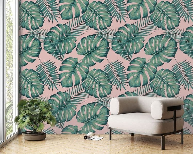 Seamless tropical pattern with leaves monstera and areca palm leaf on a pink background